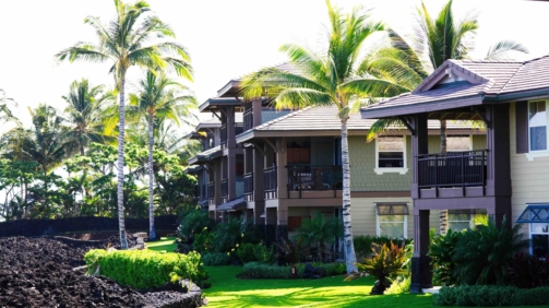 Kona, Hawaii, United States - June 01, 2011: Resort Buildings With Palm Trees And Green Grass On Big Island